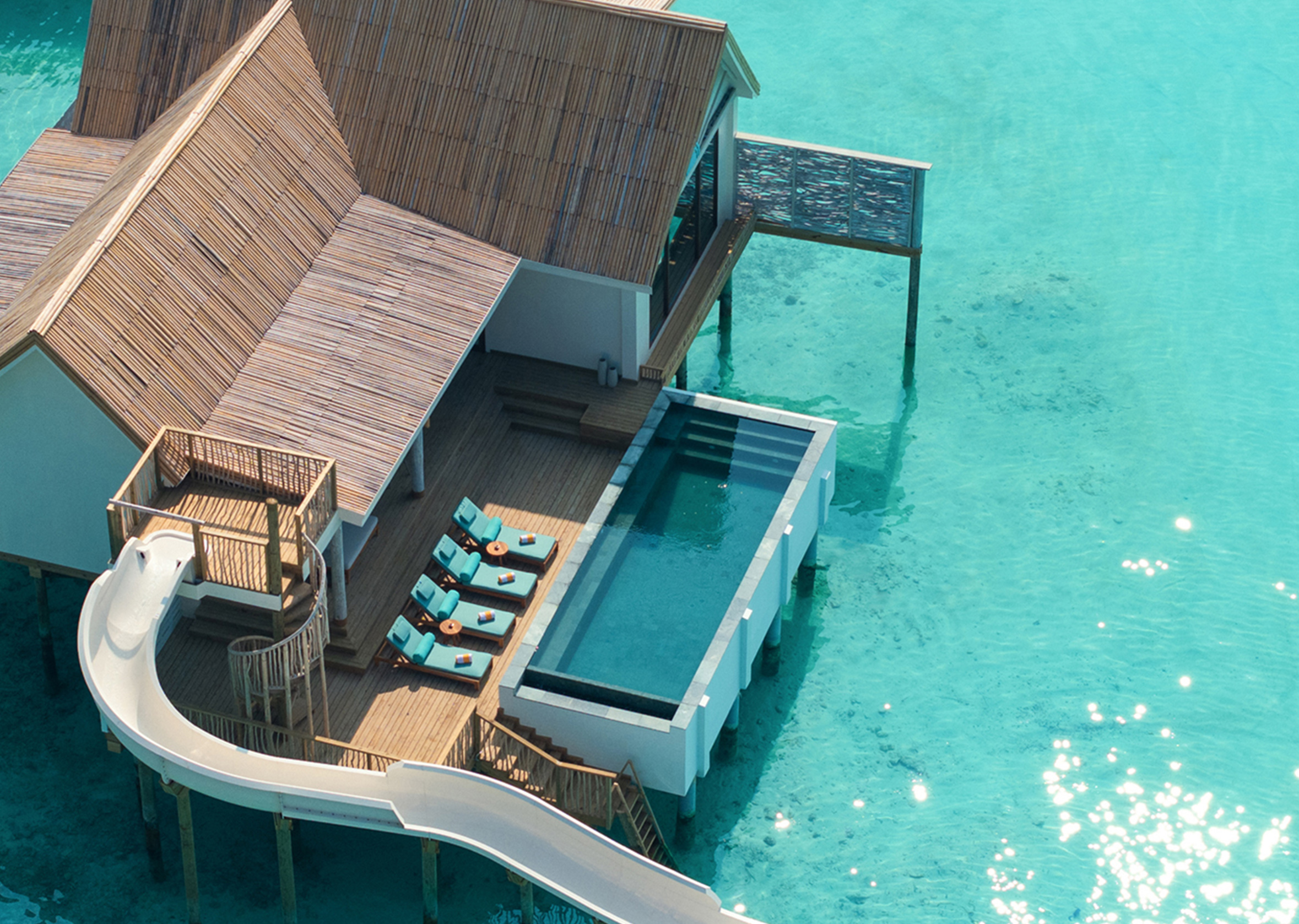 Aerial view of a water pool villa with slide